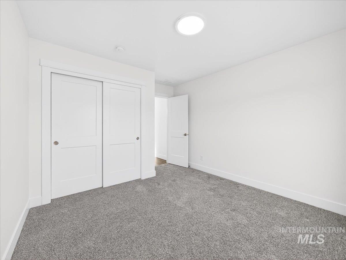 1410 Regency Way Emmett, ID 83617 - Photo 33 of 46 Unfurnished bedroom with carpet flooring and a closet