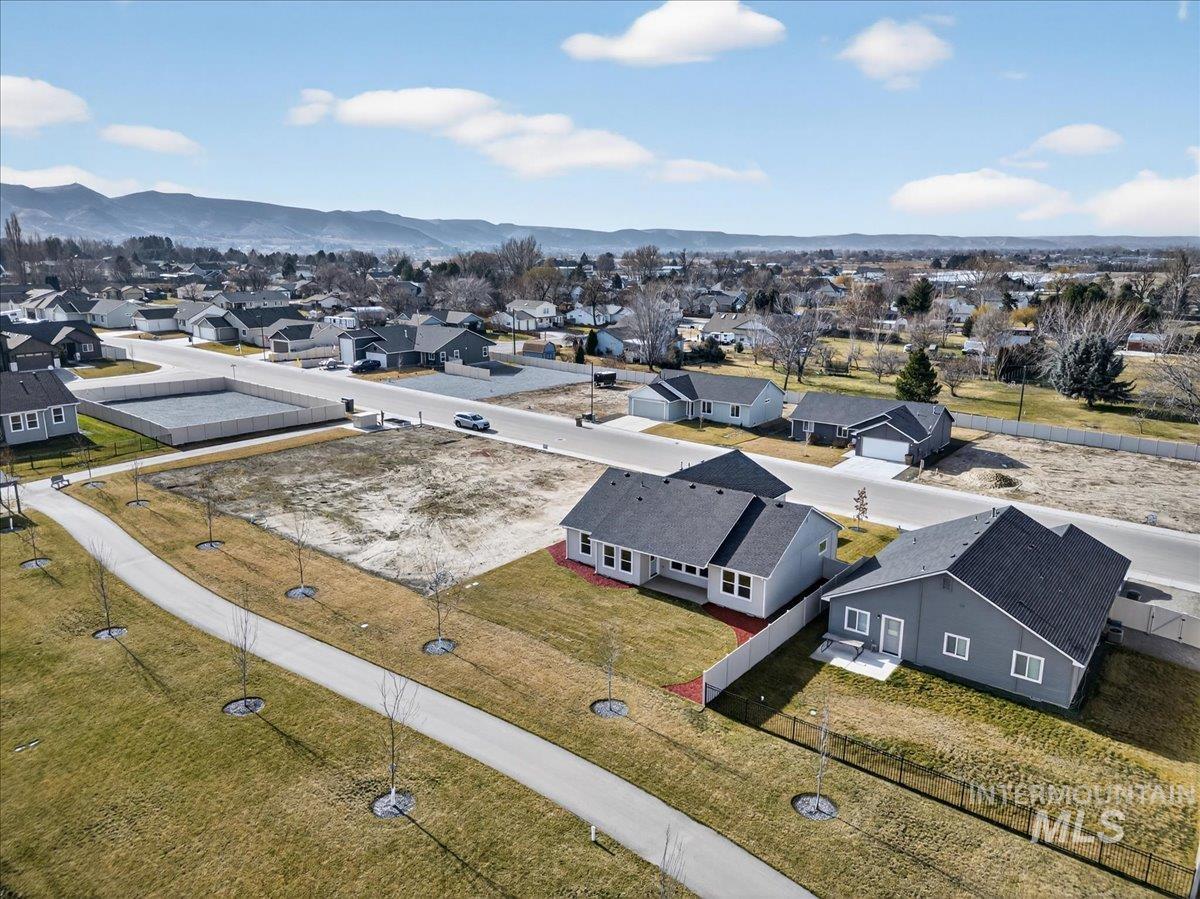 1410 Regency Way Emmett, ID 83617 - Photo 41 of 46 Aerial perspective of suburban area featuring mountains