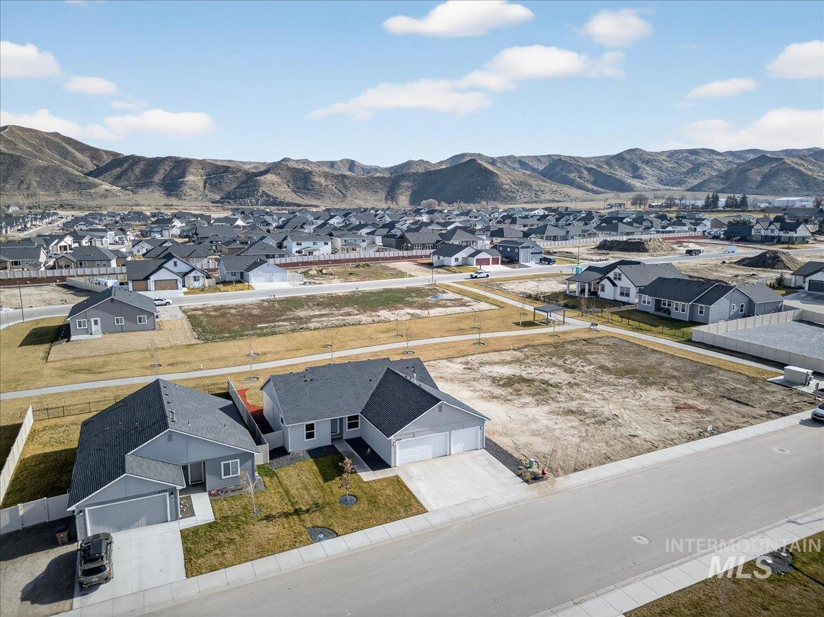 1410 Regency Way Emmett, ID 83617 - Photo 5 of 46 Aerial perspective of suburban area with a mountainous background