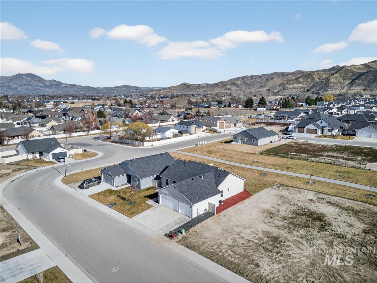 1410 Regency Way Emmett, ID 83617 - Photo 6 of 46 Aerial perspective of suburban area featuring mountains