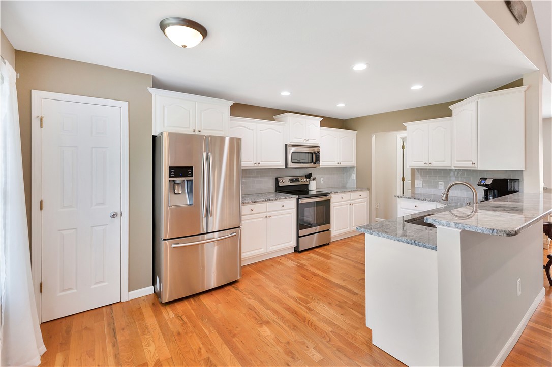 131 Morgan Road West Union, SC 29696 - Photo 10 of 39 A chef-inspired kitchen features gleaming stainless steel appliances, abundant cabinetry, and a spacious island.