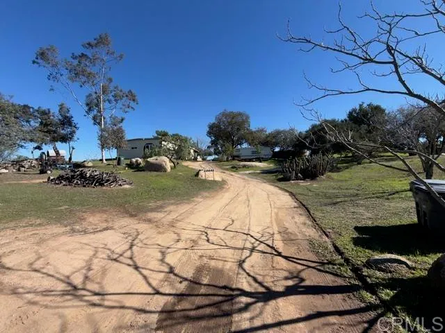 a view of swimming pool with a yard