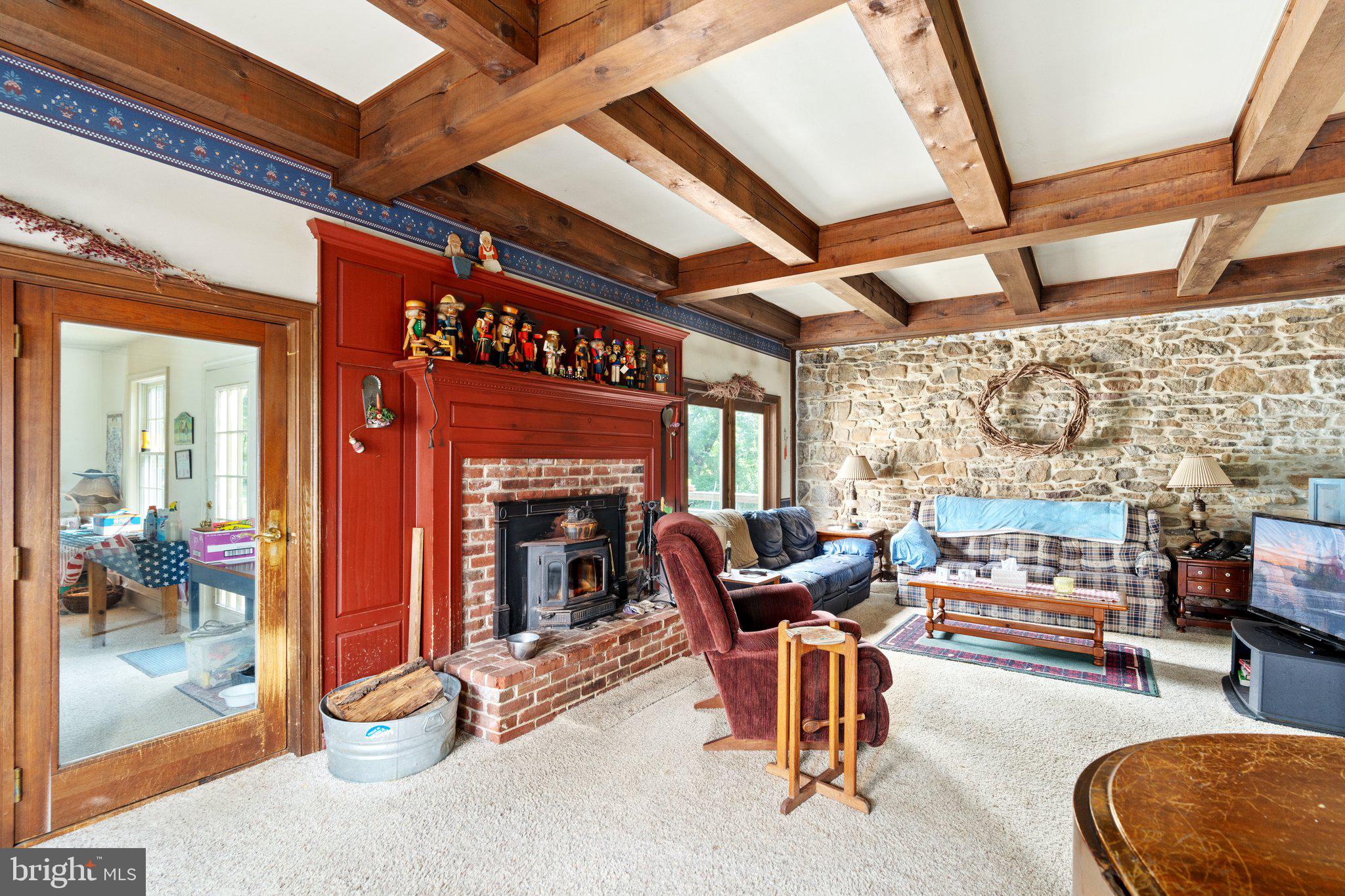 1760 Kumry Road Quakertown, PA 18951 - Photo 32 of 57 Family room fireplace with wood stove insert
