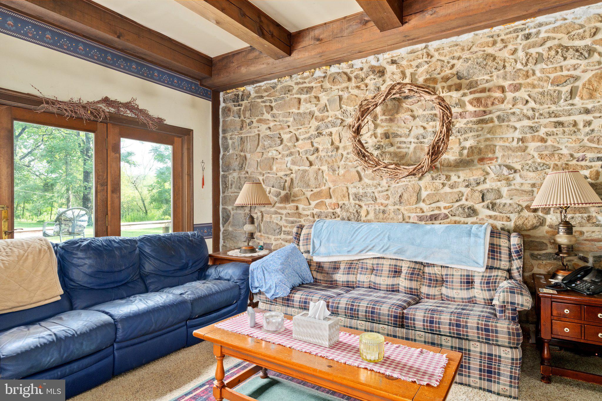 1760 Kumry Road Quakertown, PA 18951 - Photo 33 of 57 Family room with exposed stone wall