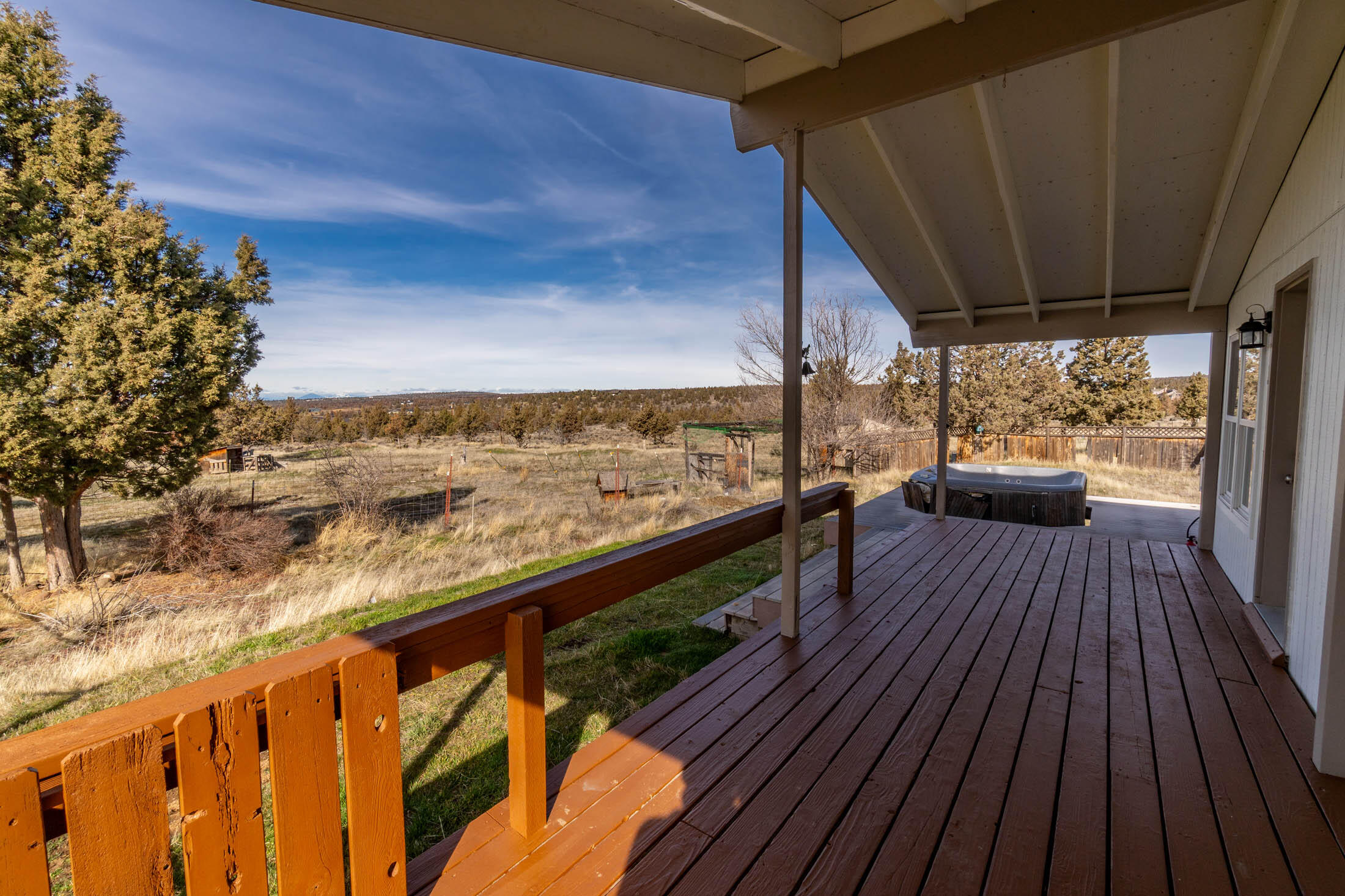 10113 Ridgeview Road Prineville, OR 97754 - Photo 22 of 31 a view of roof deck with wooden floor and outdoor seating