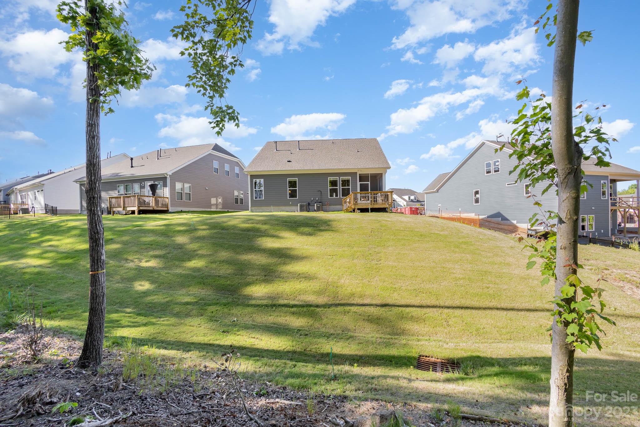 17150 Sand Bank Road Charlotte, NC 28278 - Photo 30 of 32 a view of a house with a yard