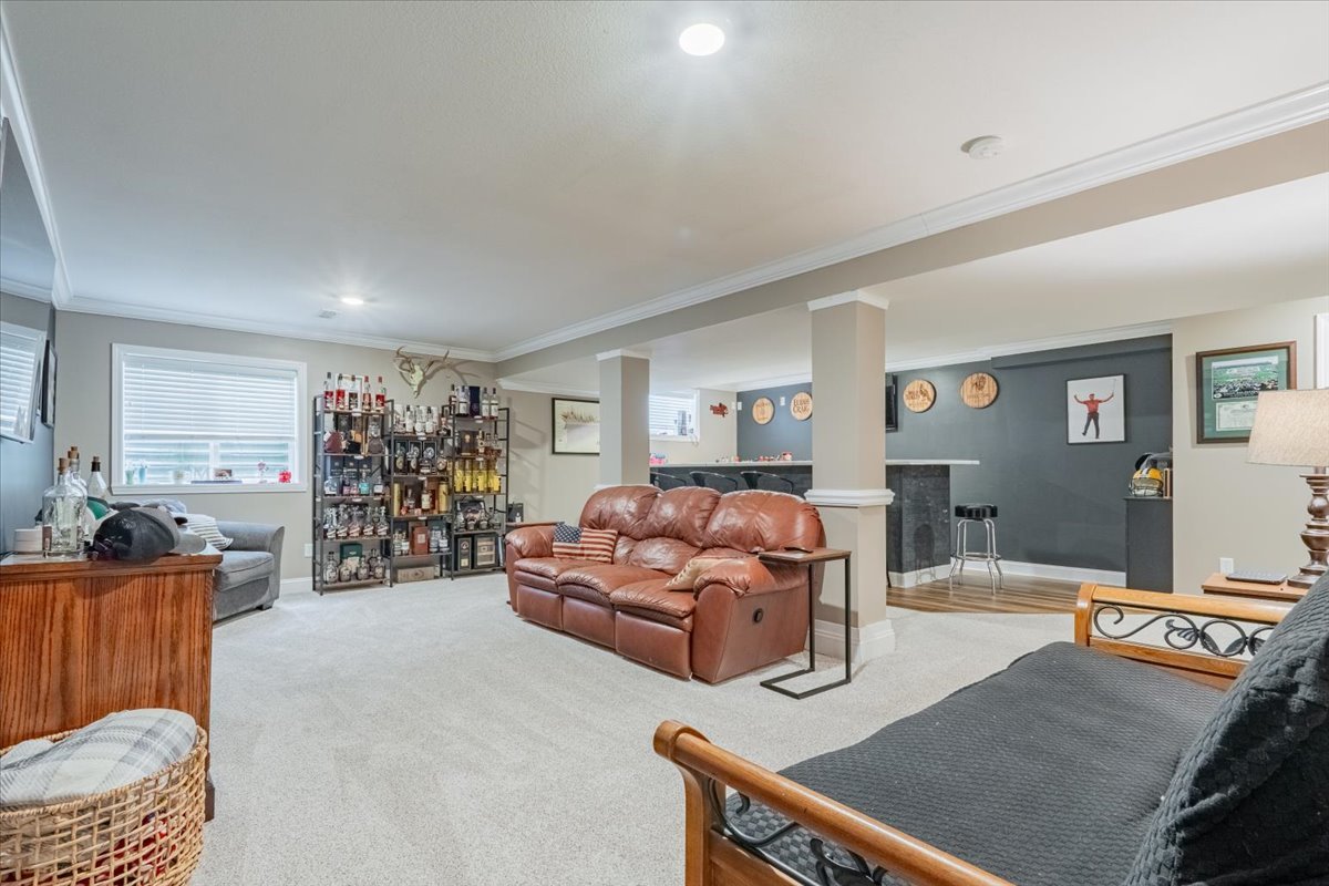 13561 Buck Road Bloomington, IL 61705 - Photo 33 of 43 a living room with furniture and a flat screen tv