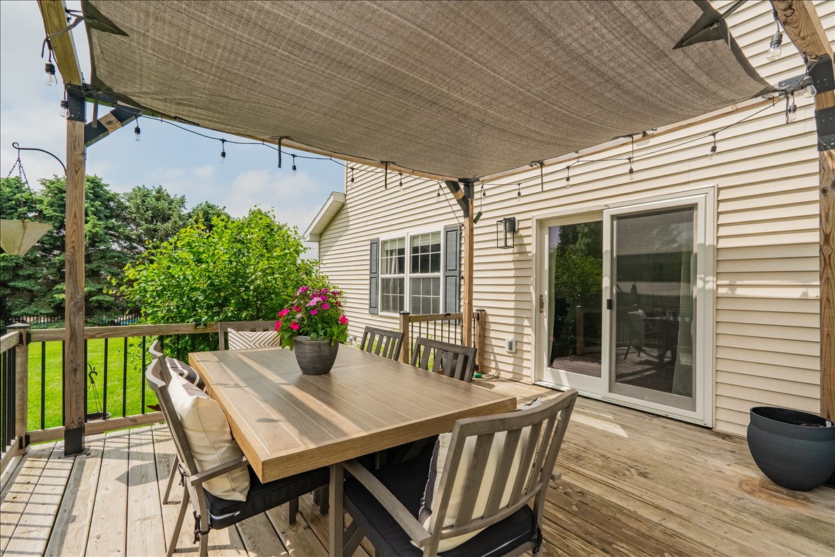 13561 Buck Road Bloomington, IL 61705 - Photo 38 of 43 a view of a patio that has a table and chairs