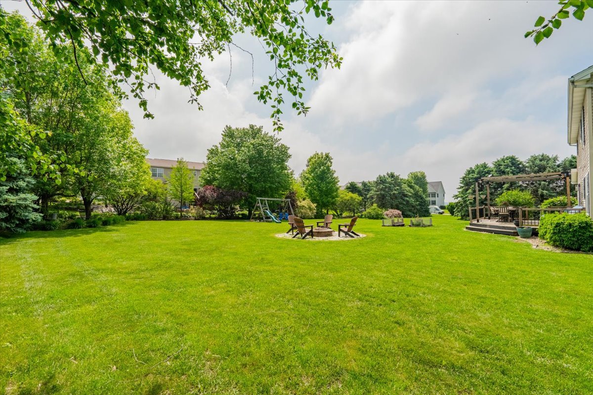 13561 Buck Road Bloomington, IL 61705 - Photo 39 of 43 a view of yard with swimming pool and green space