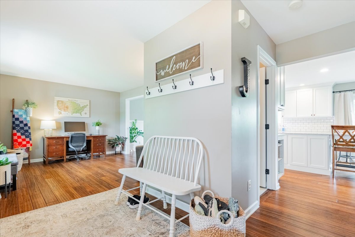 13561 Buck Road Bloomington, IL 61705 - Photo 6 of 43 a living room with furniture and a wooden floor