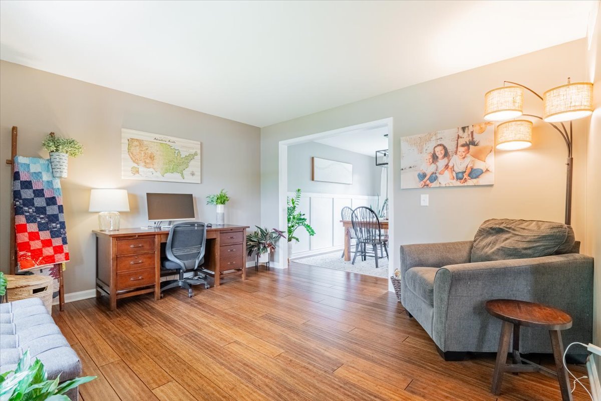 13561 Buck Road Bloomington, IL 61705 - Photo 7 of 43 a living room with furniture and wooden floor
