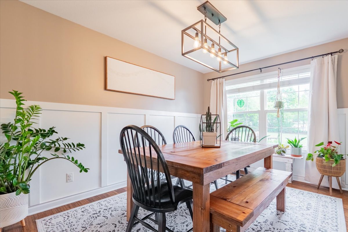 13561 Buck Road Bloomington, IL 61705 - Photo 9 of 43 a view of a dining room with furniture window and wooden floor