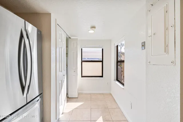 a kitchen with a refrigerator stove and microwave