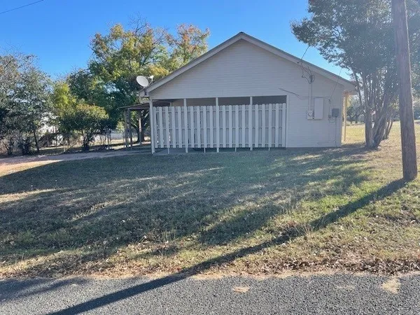 a view of a house with a yard and garage