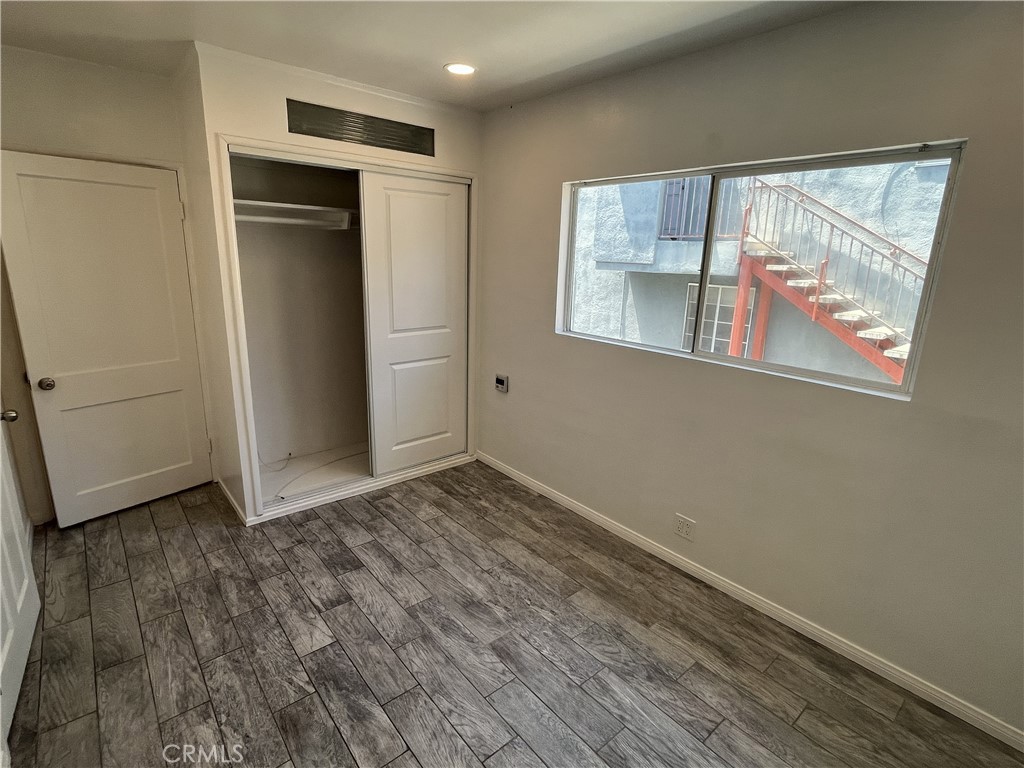 3112 Washington Boulevard Venice, CA 90291 - Photo 10 of 13 a view of an empty room with wooden floor and a window