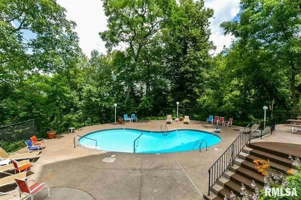 a view of a swimming pool with a patio