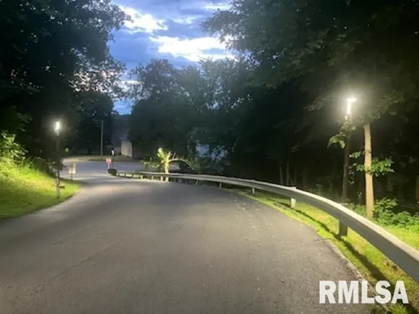 a view of swimming pool with outdoor seating and a pathway