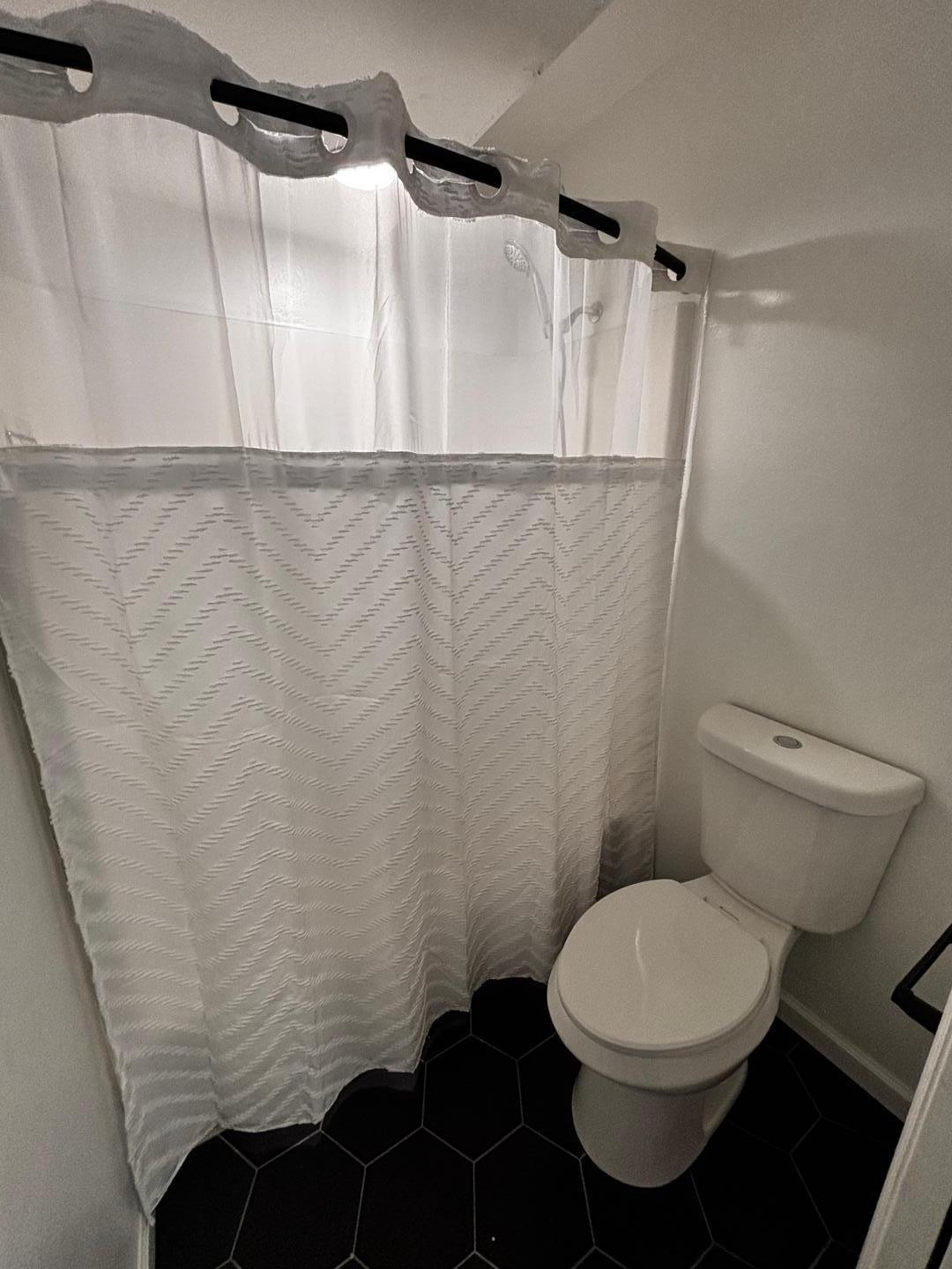 3030 North Hayden Road, Unit 16 Scottsdale, AZ 85251 - Photo 12 of 30 a white toilet sitting next to a shower