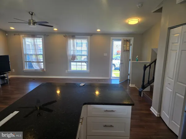a view of kitchen and hall with a window