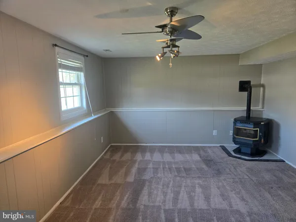 a view of a room with gym equipment and a window