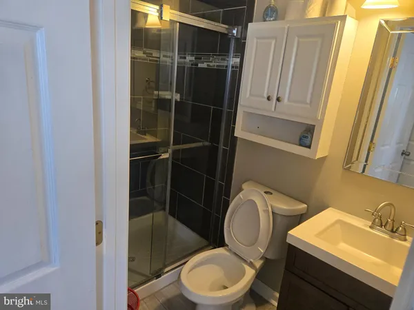 a bathroom with a toilet and a sink
