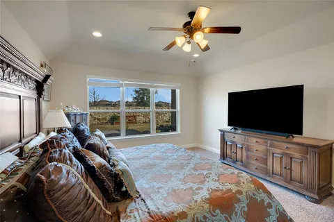 a view of a livingroom with furniture and a flat screen tv