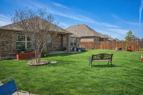 a garden view with a seating space