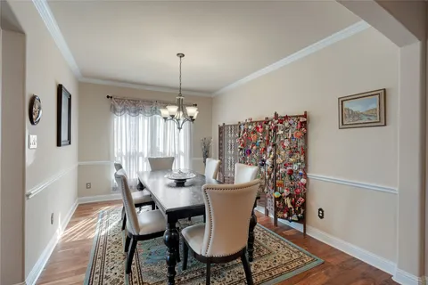 a view of a dining room with furniture and window