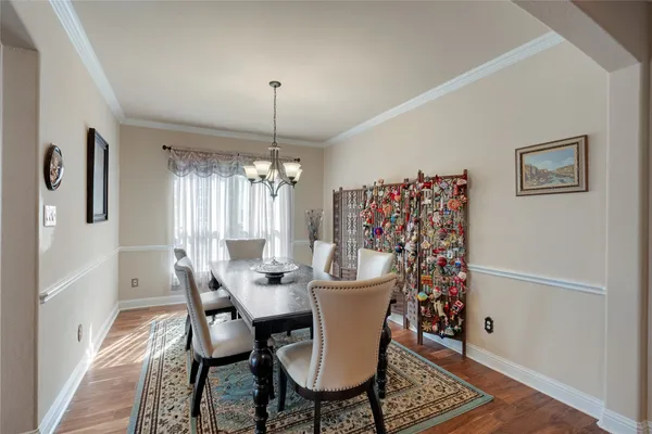 a view of a dining room with furniture and window