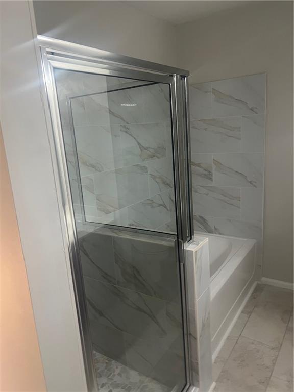 3500 Sweetwater Road, Unit 424 Duluth, GA 30096 - Photo 10 of 17 a bathroom with a glass shower door