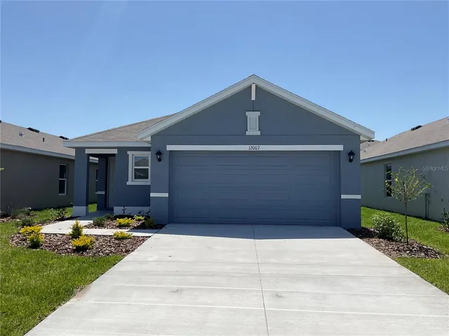 a front view of a house with yard