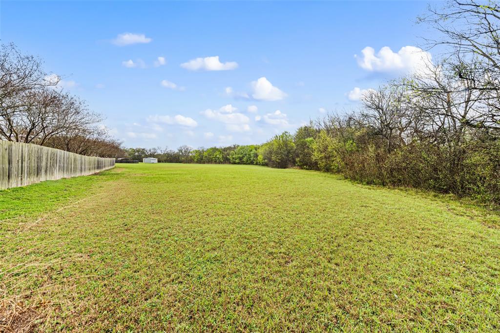 517 Chado Lane Robinson, TX 76706 - Photo 36 of 40 View of grassy yard behind fence.
