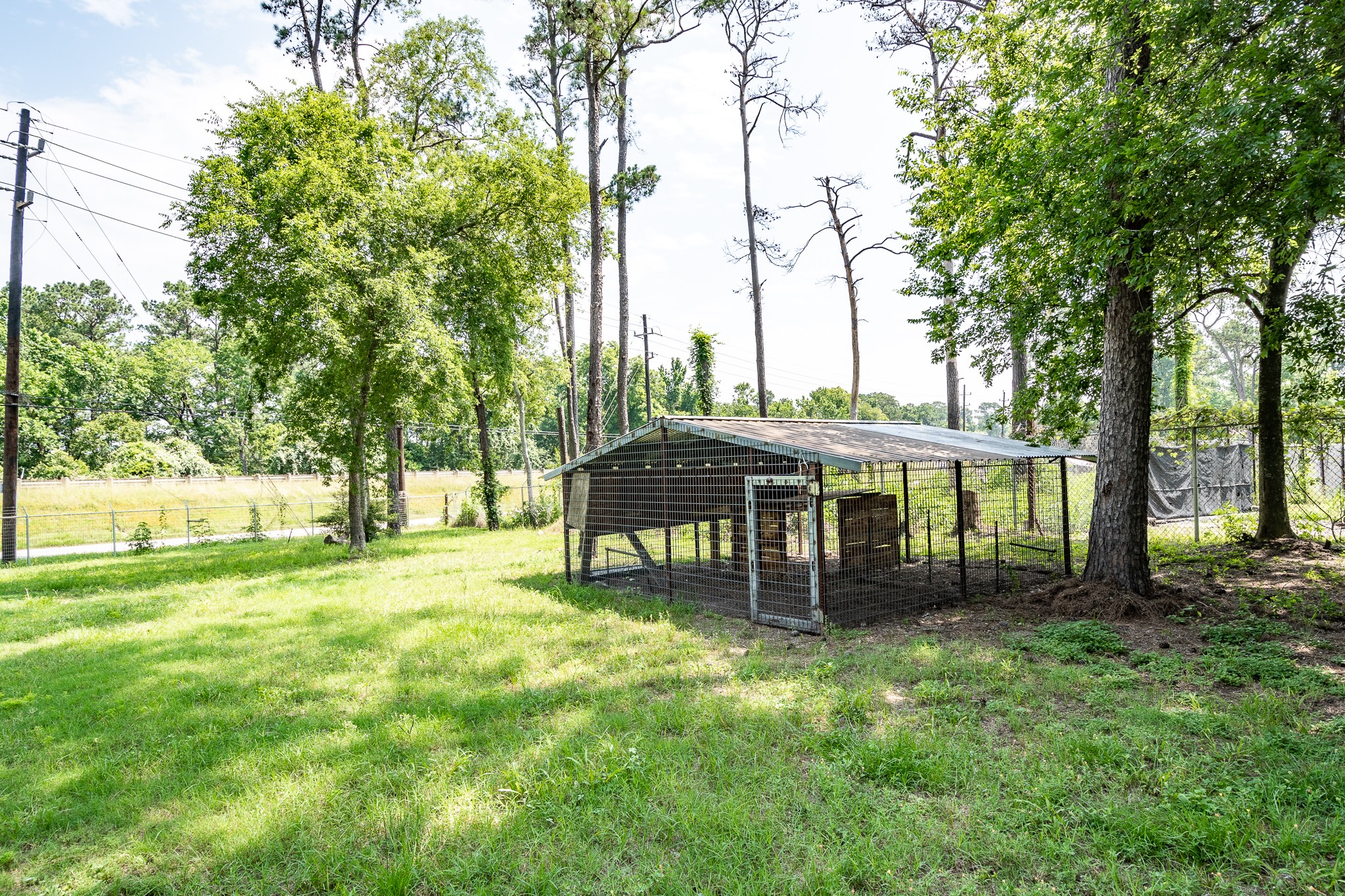 1421 Gulf Pump Road Crosby, TX 77532 - Photo 11 of 11 a front view of a house with a garden and trees