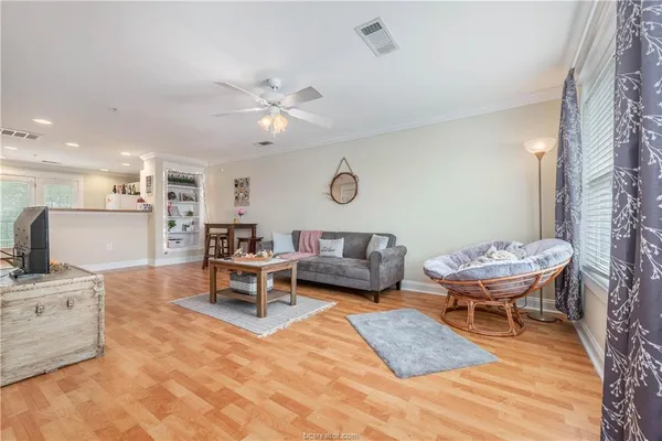 a living room with furniture a table and chairs