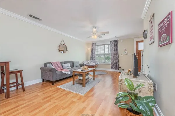a living room with furniture and a table