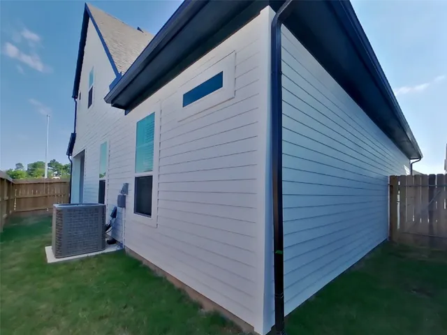 a view of swimming pool with outdoor seating and city view