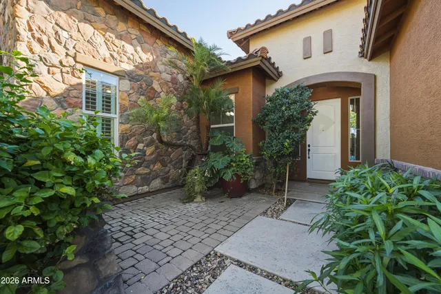 a view of a dining room with furniture and a chandelier