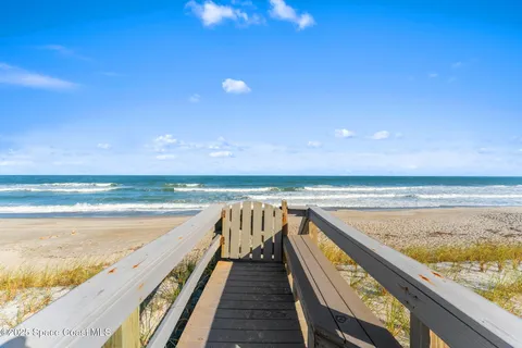 a view of an ocean and a houses