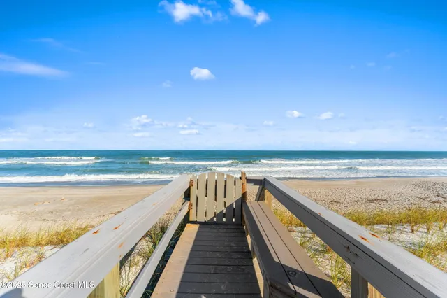 a view of an ocean and a houses