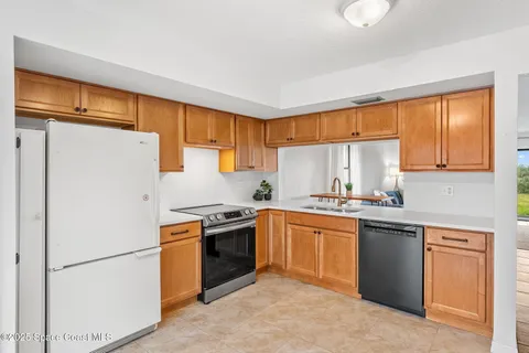a view of a kitchen with a stove cabinets and a kitchen