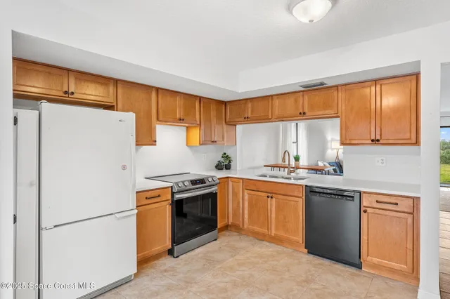 a view of a kitchen with a stove cabinets and a kitchen