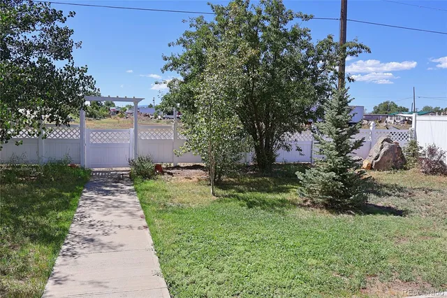 a backyard of a house with lots of green space