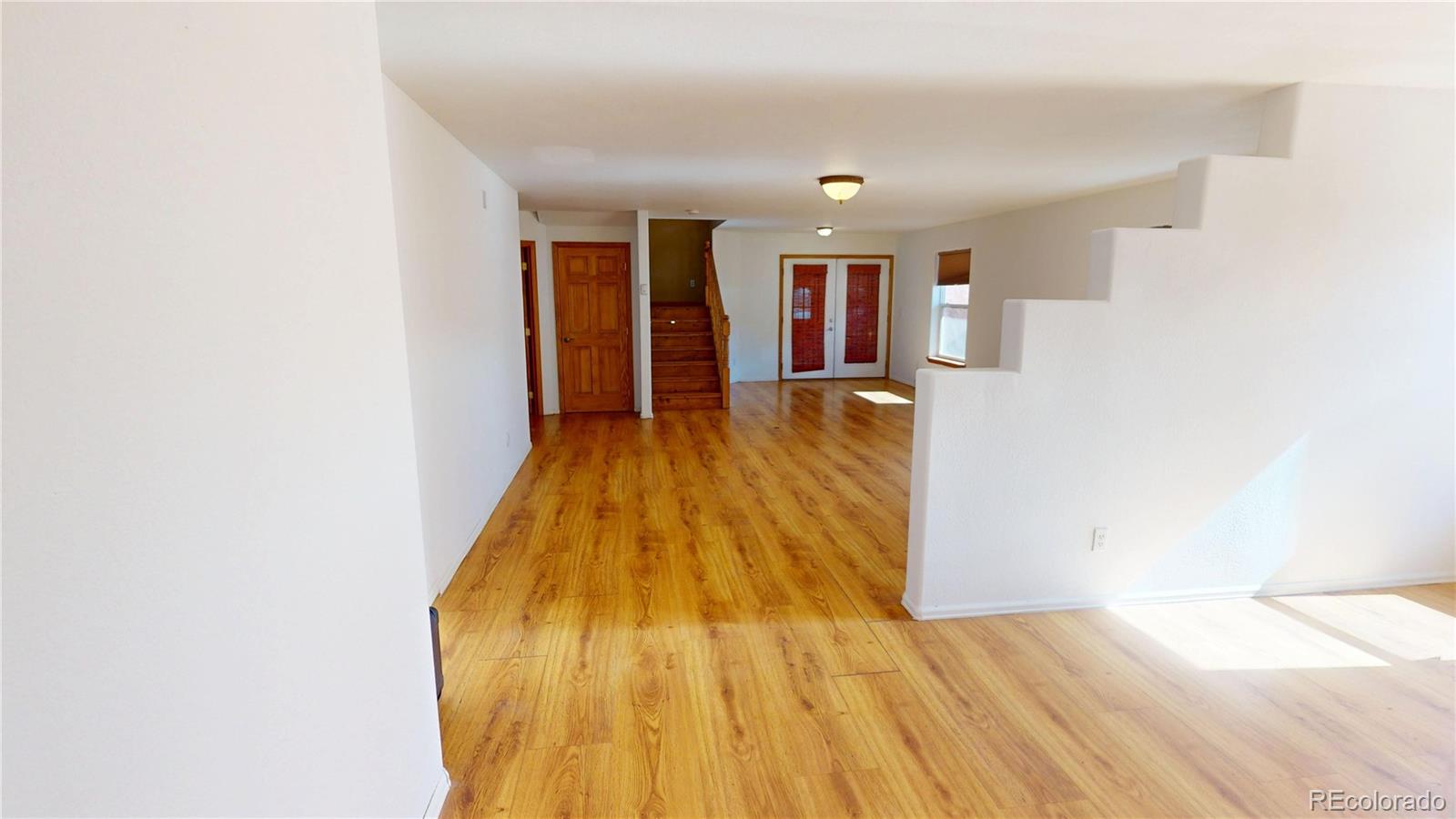 309 Main Street Romeo, CO 81148 - Photo 21 of 41 a view of a living room with wooden floor