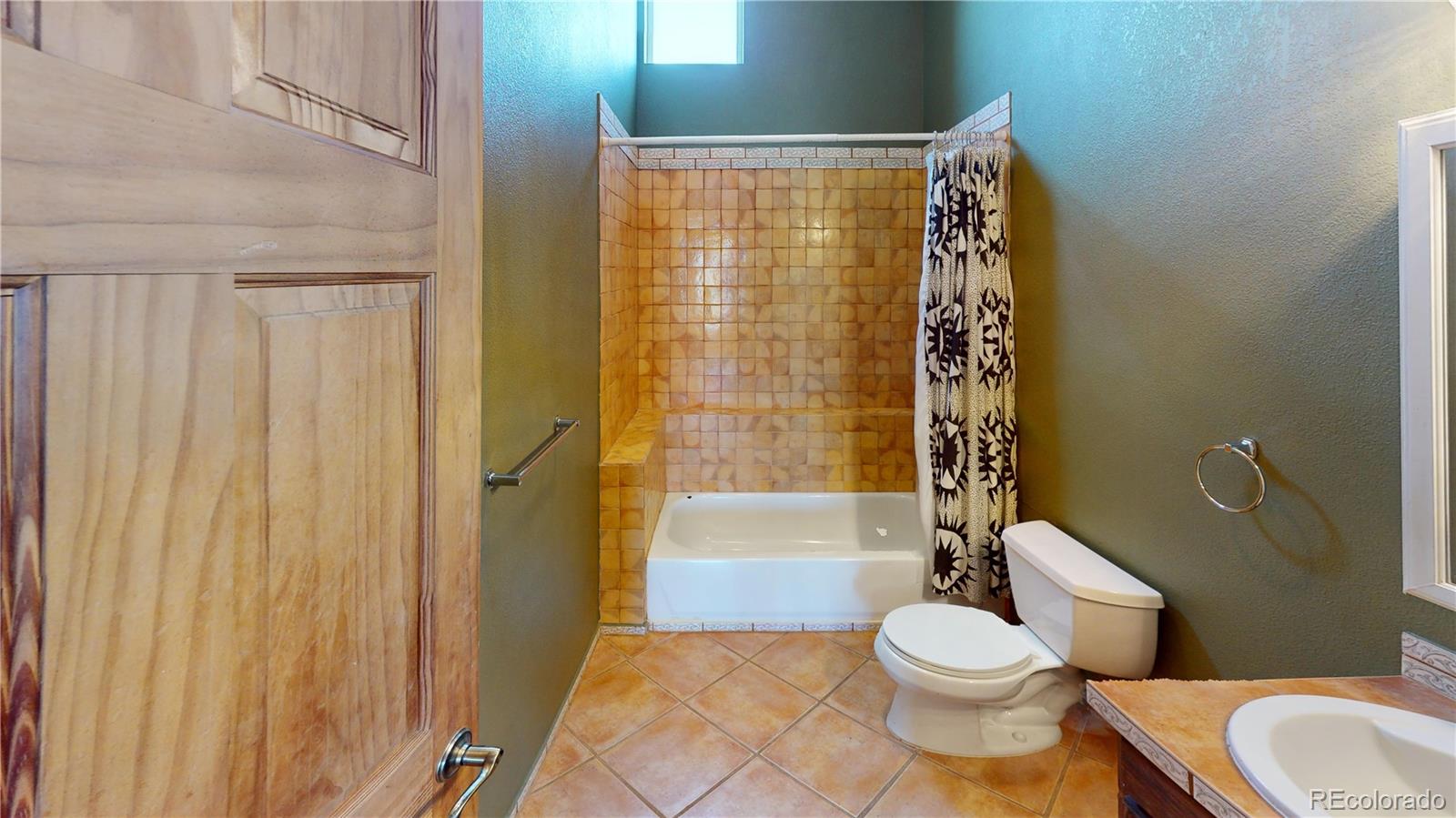 309 Main Street Romeo, CO 81148 - Photo 27 of 41 a bathroom with a toilet a sink and bathtub