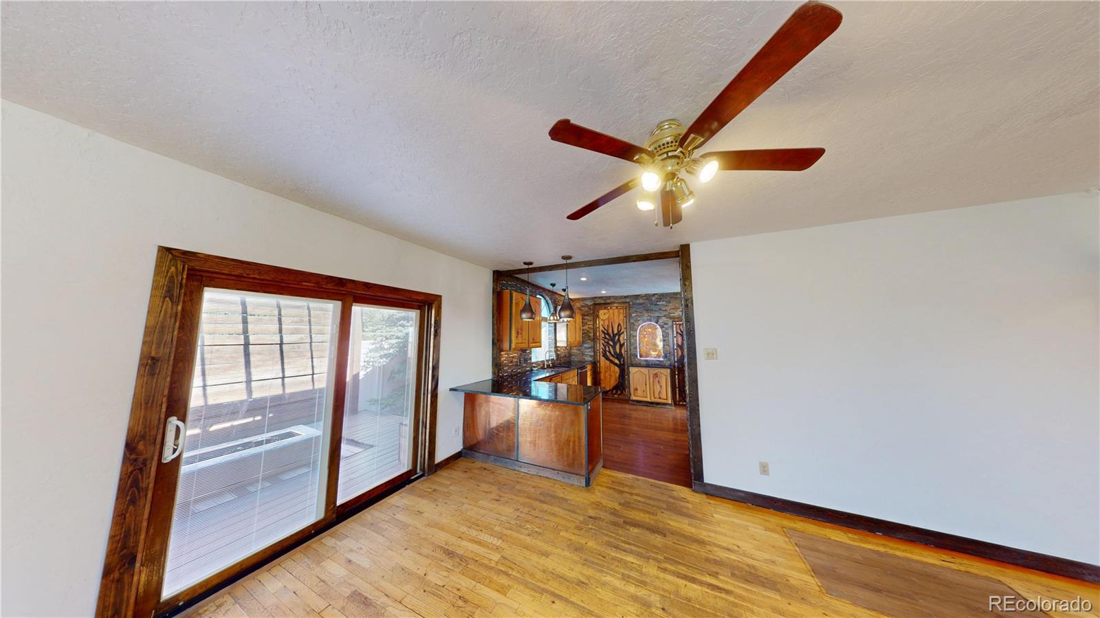 309 Main Street Romeo, CO 81148 - Photo 5 of 41 a view of an empty room and window
