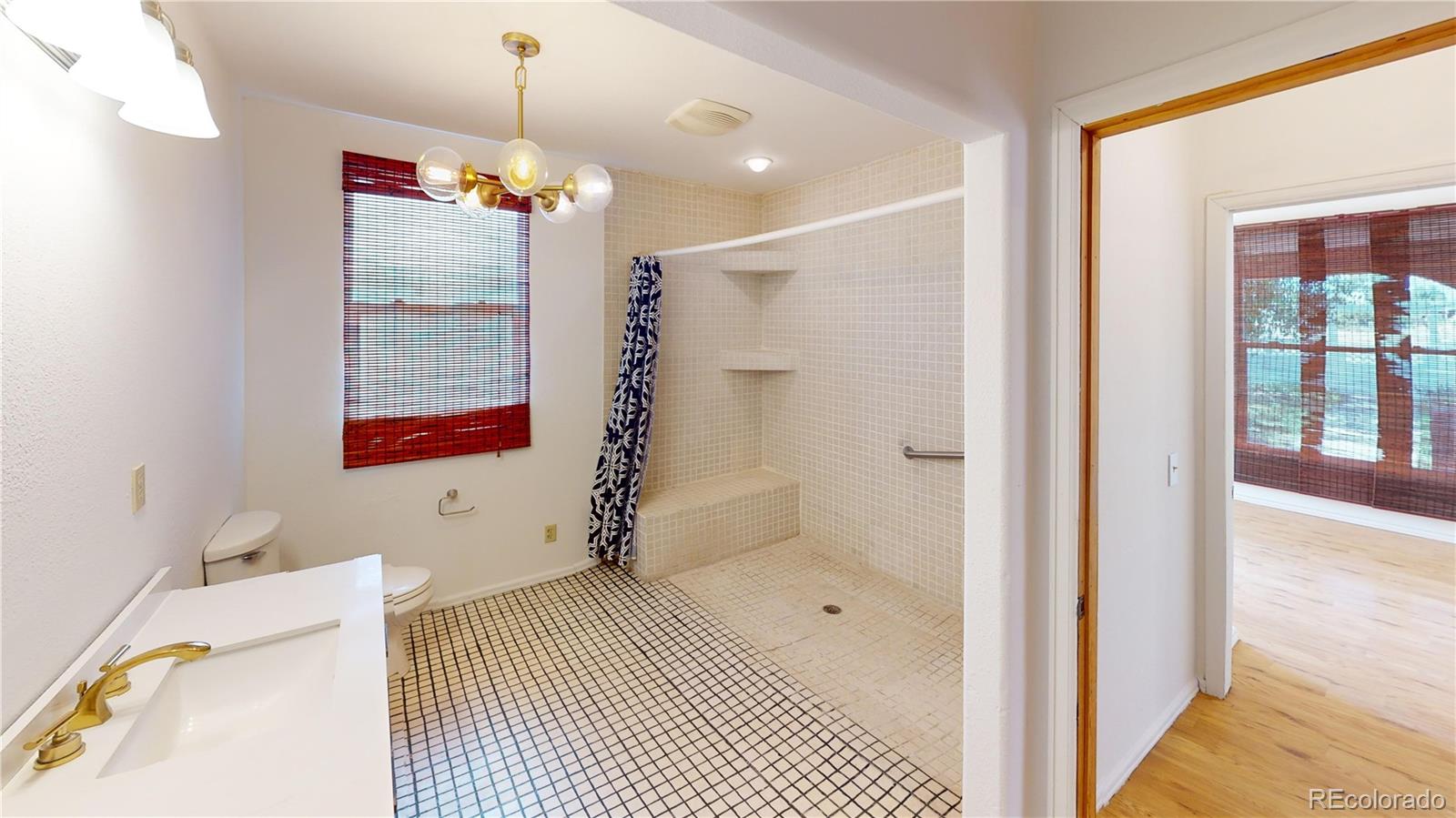 309 Main Street Romeo, CO 81148 - Photo 10 of 41 a bathroom with a bathtub and shower