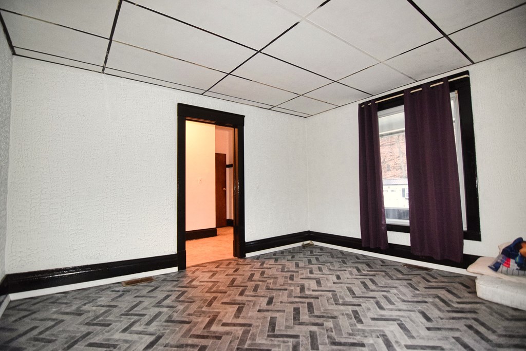 126 Cherry Run Road Rouseville, PA 16344 - Photo 5 of 20 a room with a wooden floor and a window
