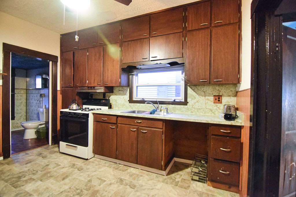 126 Cherry Run Road Rouseville, PA 16344 - Photo 10 of 20 a kitchen with stainless steel appliances granite countertop a sink stove and cabinets