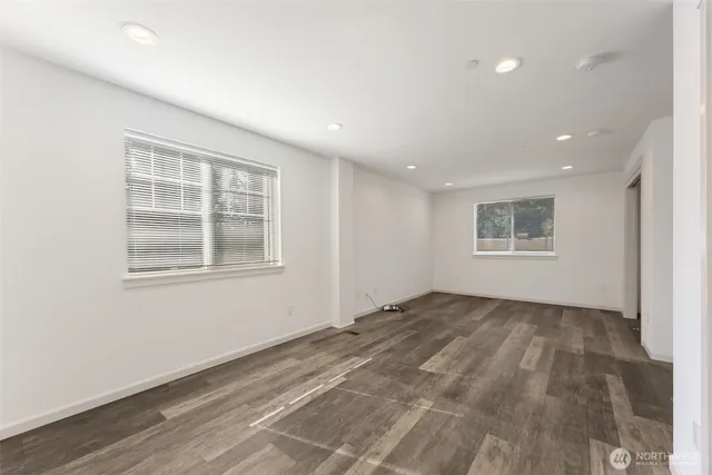 a view of empty room with windows