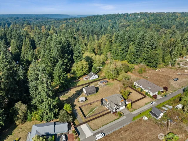 a aerial view of a house with a yard
